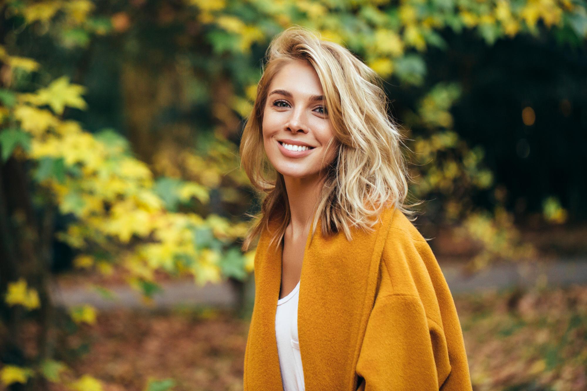 Woman Smiling Outdoors 829640064